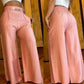 Damskie spodnie z wysokim stanem i szerokimi nogawkami z paskiem